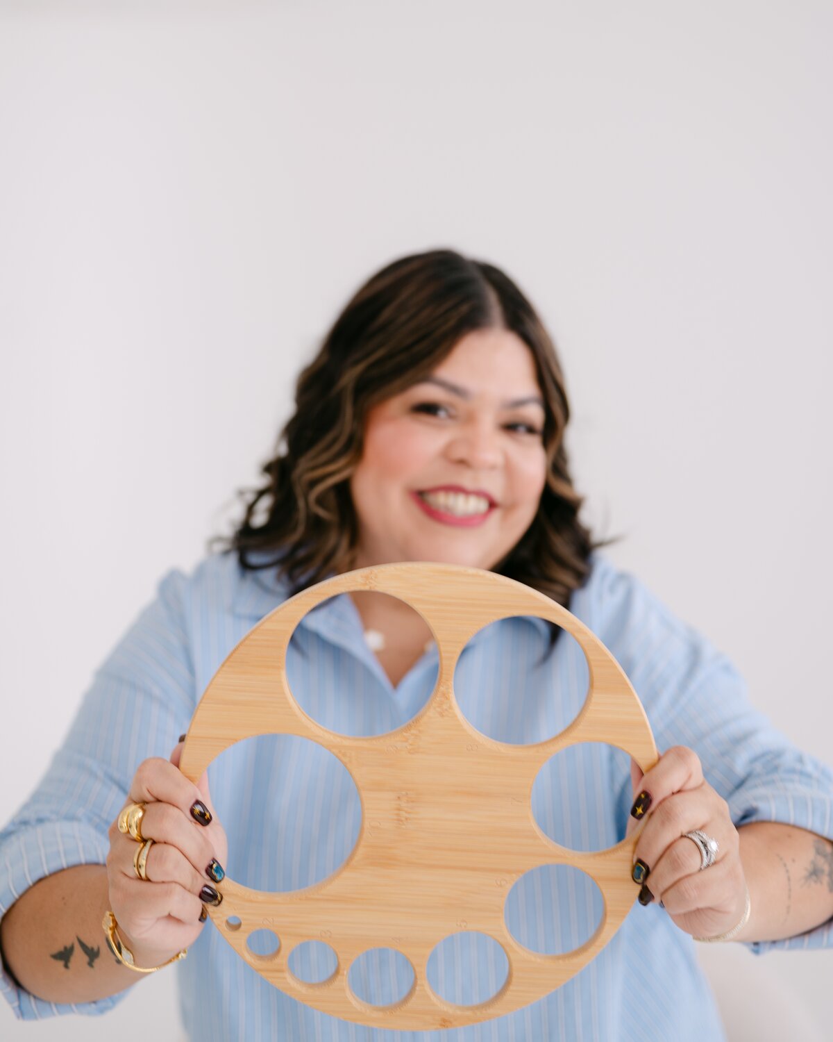 Melanie holding a cervical dilation model used in her childbirth classes